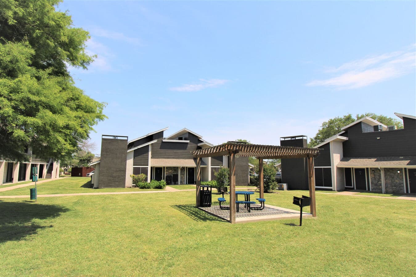 Open lawn and mature landscaping at Bay Island in Garland, Texas